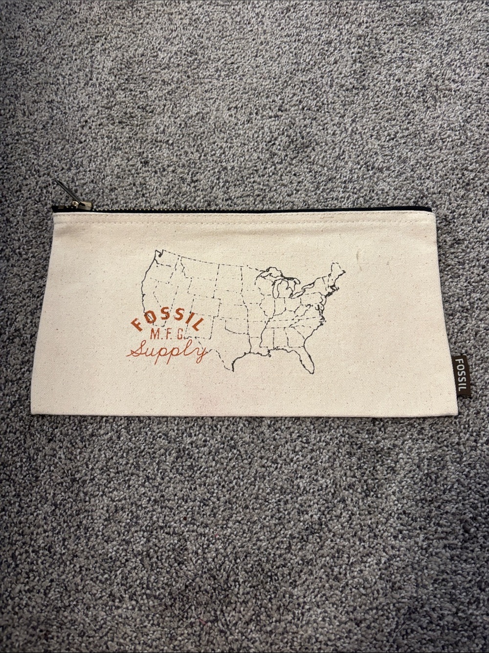 Fossil Canvas Zip Pouch — Cream with Black and Orange Print